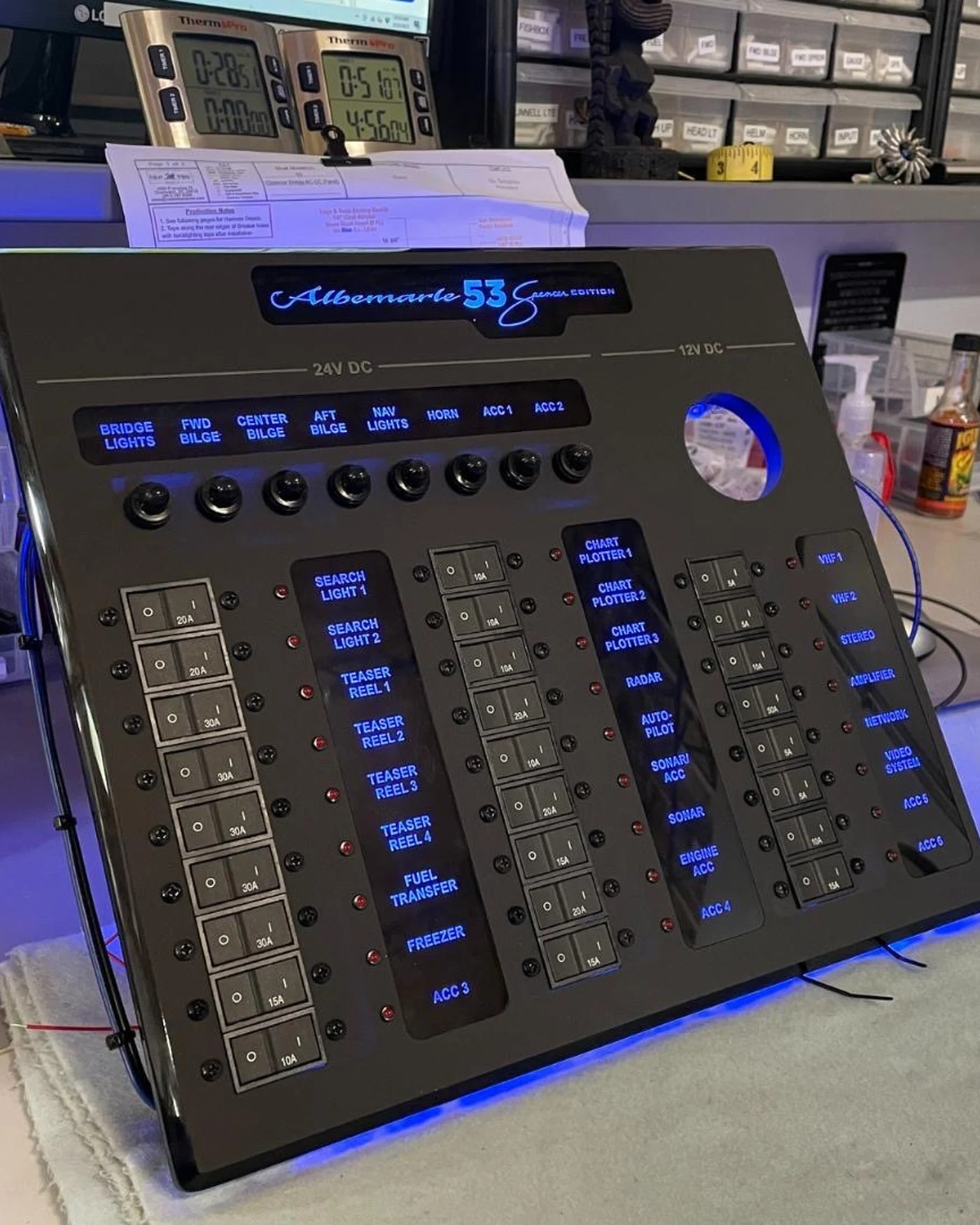A custom-built, illuminated switch panel bench-tested before installation
