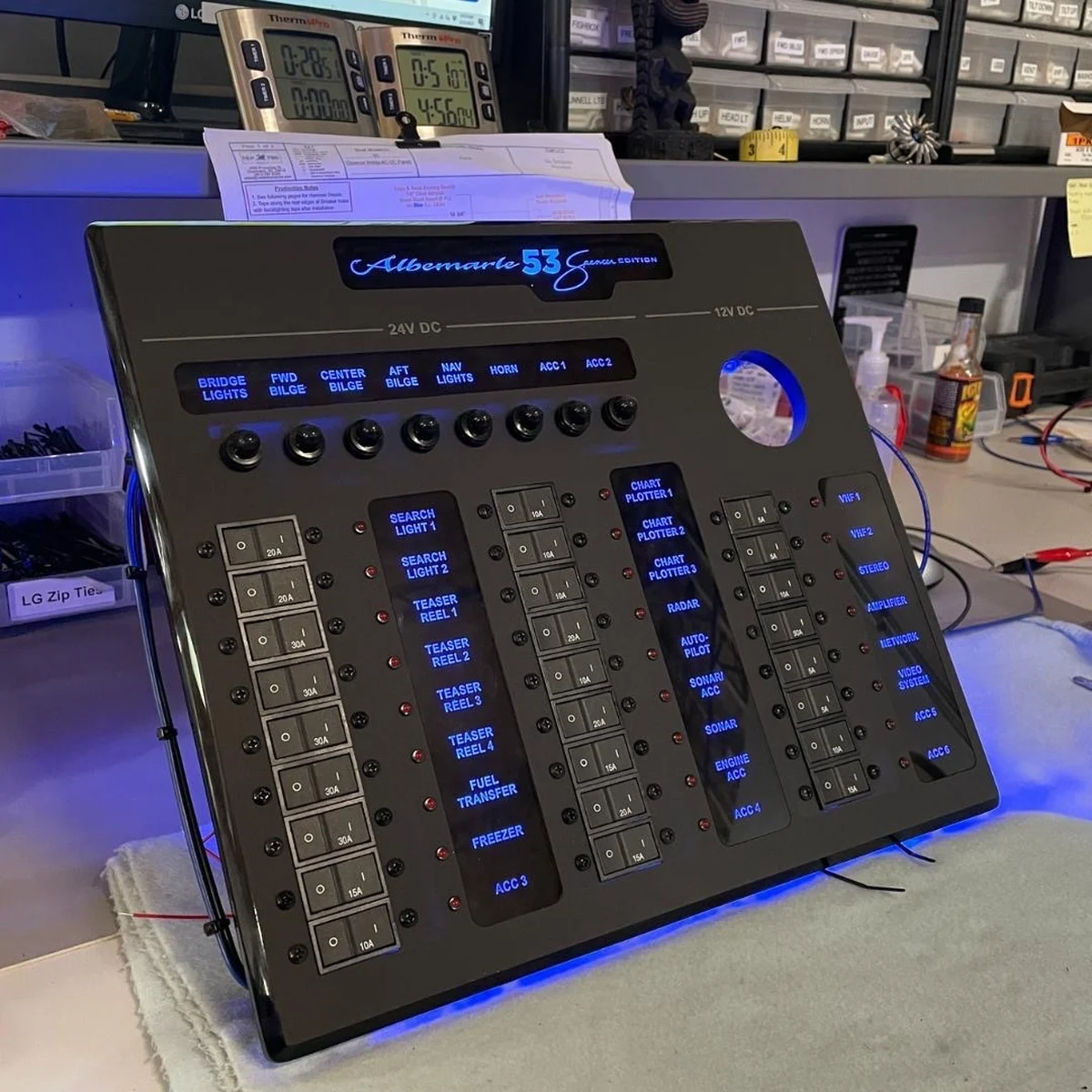 A custom-built, illuminated Albemarle 53 switch panel, backlit and bench-tested before installation