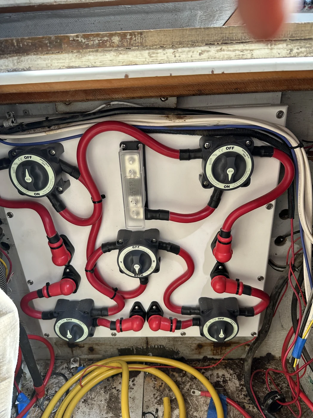 A bank of Blue Sea battery switches wired with neatly routed cabling