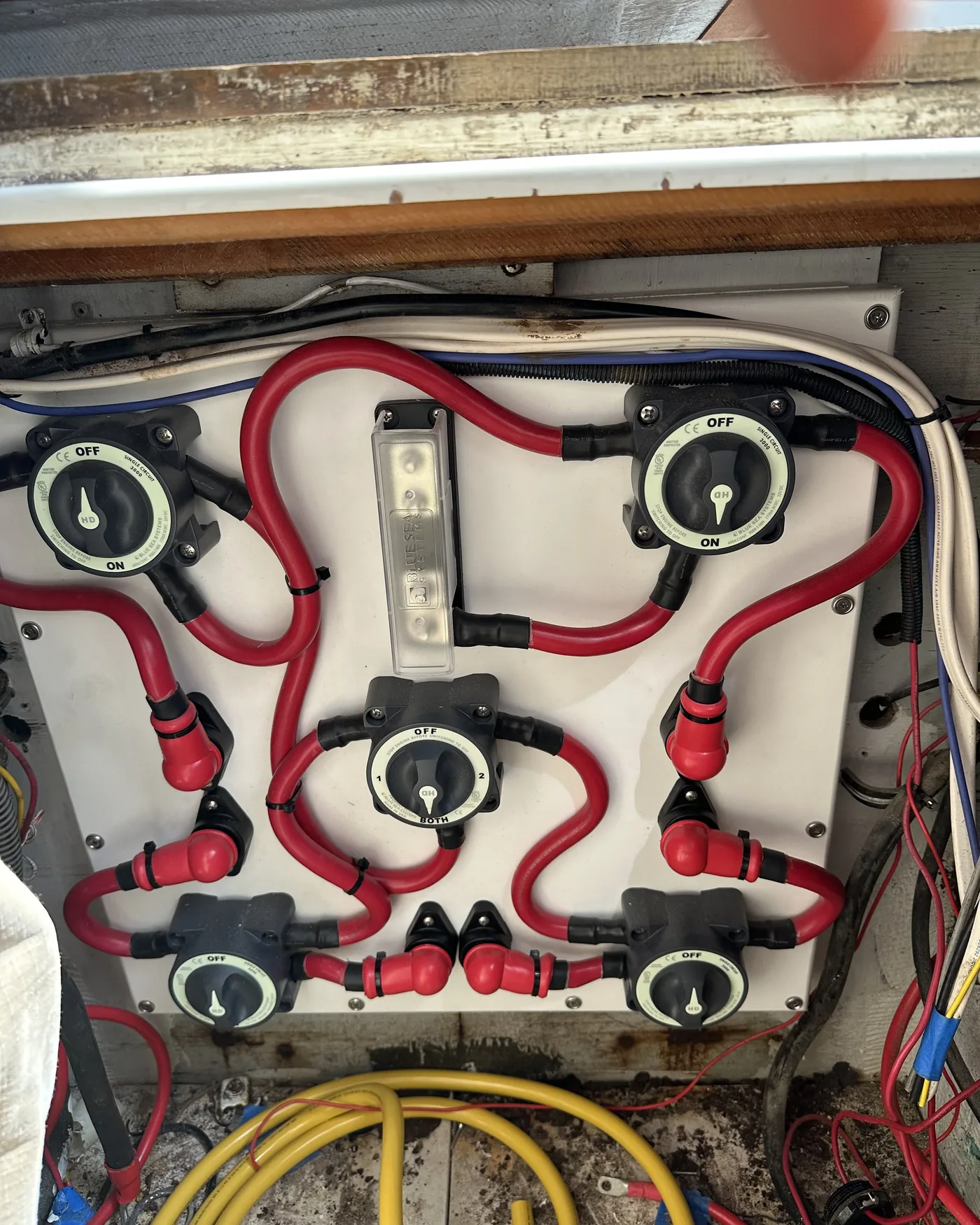 A bank of battery switches wired for isolated and parallel bank selection