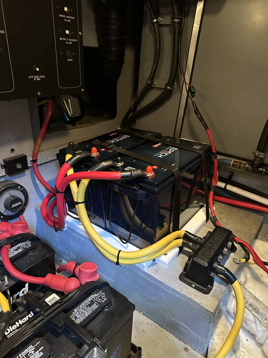 An EPOCH lithium battery bank installed and strapped down with tinned cable connections