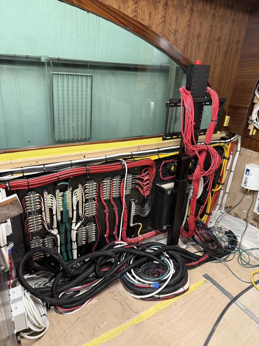 A distribution panel and TV mount wired in during a full helm refit