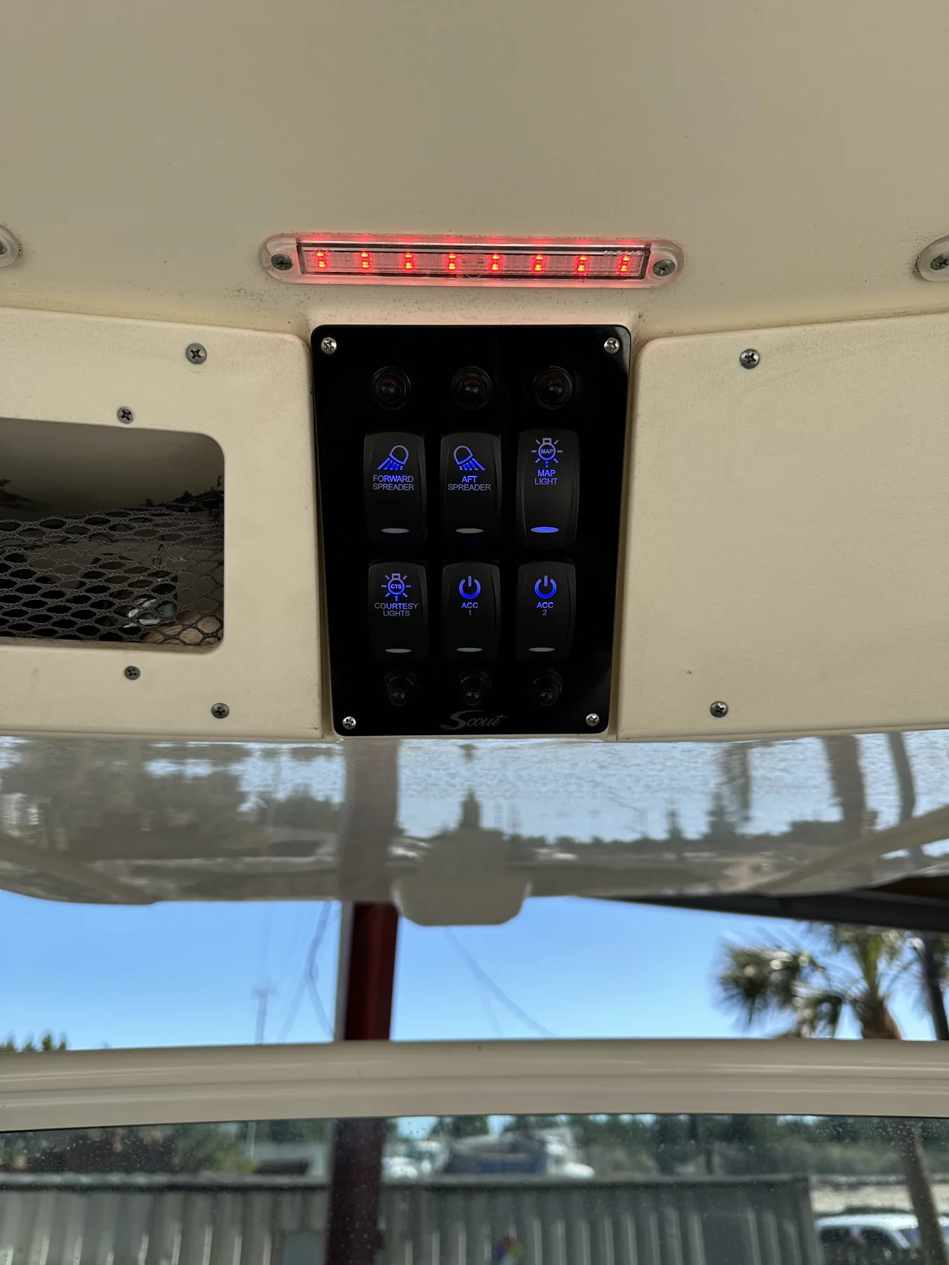 Backlit overhead switch panel for spreader lights, map light, and accessory circuits