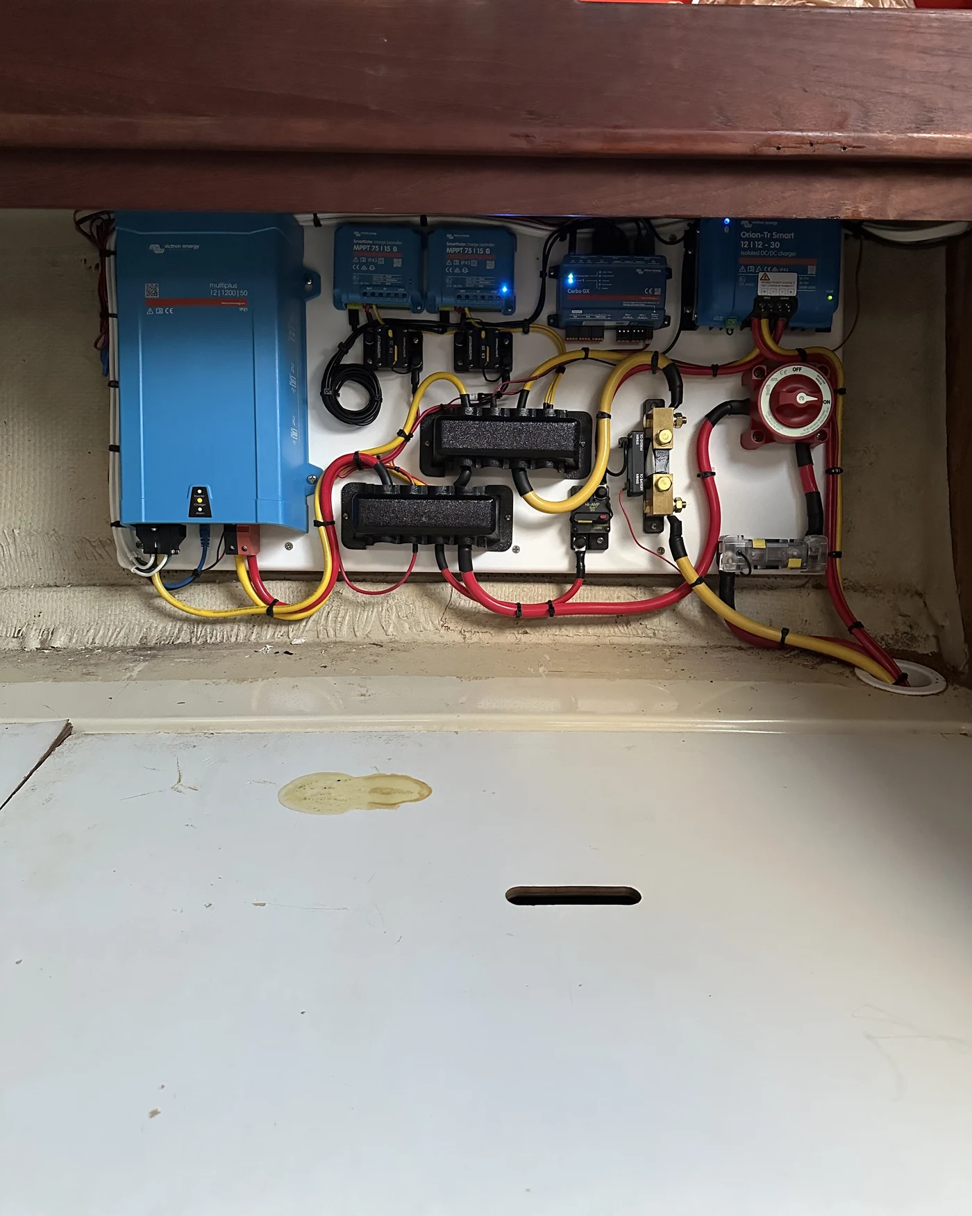 A Victron power system, MultiPlus-II, dual MPPT solar controllers, Cerbo GX monitor, and Orion-Tr Smart charger, wired and installed